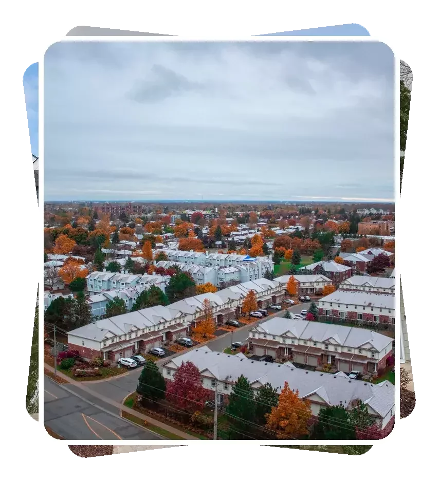 Aerial view of an older condominium townhouse community in autumn